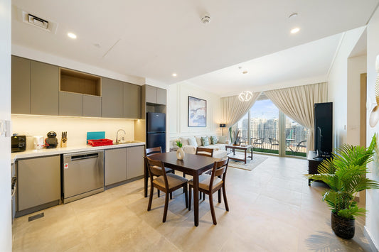 a kitchen and dining room with a view of the city