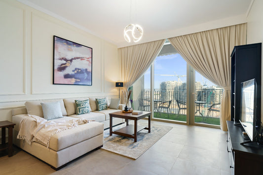 a living room filled with furniture and a flat screen tv