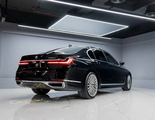 a black car is parked in a garage